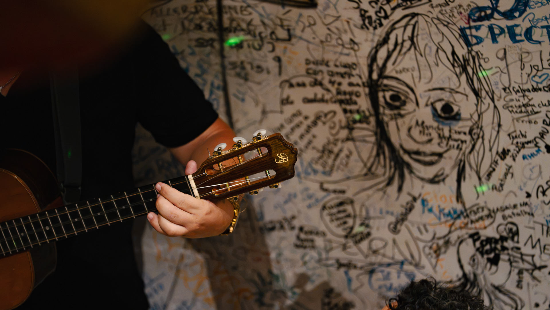 Close-up of a customer's signature on the wall at Che Habana Café